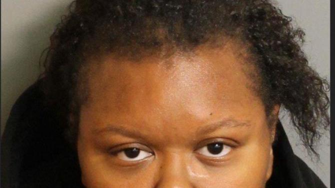 This photo provided by the Birmingham Police Department shows a police mug shot of Katerra Lewis, 26, of Birmingham, who was arrested on a murder charge, Tuesday, Nov. 10, 2015, in Birmingham, Ala. Police say an 8-year-old Alabama boy is charged with beating a 1-year-old girl to death while they were left home alone. A warrant has been obtained against the boy, and Lewis, who is also charged with manslaughter in the death of 1-year-old Kelcia Lewis. Birmingham police spokesman Sean Edwards says the girl began crying while the children were left alone and the boy attacked her. Police say the girl suffered severe head trauma and major damage to her internal organs. (Birmingham Police Department via AP)