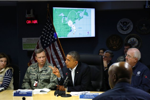U.S. President Obama asks a question during a FEMA briefing about Hurricane Sandy as it threatens the East Coast, at FEMA headquarters in Washington