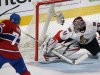 Ottawa Senators' goaltender Craig Anderson, right, is scored on by Montreal Canadiens' Michael Ryder, left, during second-period NHL hockey Game 2 first-round playoff action in Montreal, Friday, May 3, 2013. (AP Photo/The Canadian Press, Graham Hughes)