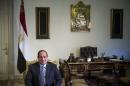 Egypt's President al-Sisi sits in his office before a meeting with U.S. Secretary of State Kerry at the Presidential Palace in Cairo
