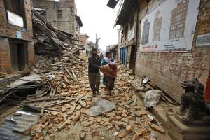An elderly injured woman is taken home through earthquake &hellip;