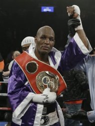 Bernard Hopkins poses for photographs after an IBF Light Heavyweight championship boxing match against Tavoris Cloud at the Barclays Center Saturday, March 9, 2013, in New York. Hopkins won by unanimous decision. (AP Photo/Frank Franklin II)