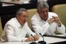 Cuba's President Castro speaks with his first vice-president Diaz Canel during a session of the National Assembly in Havana