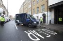 A police van believed to be transporting 22-year-old Michael Adebowale, a suspect in the murder of British soldier Lee Rigby, arrives at Westminster Magistrates Court in central London, Thursday, May 30, 2013. Two men attacked and killed the off-duty soldier in broad daylight, in southeast London's Woolwich area on Wednesday, May 22. They were shot by police and arrested on suspicion of murder. (AP Photo/Alastair Grant)