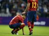 Spain's Alberto Botia consoles his team mate Alvaro Dominguez after losing their men's Group D football match against Honduras at London 2012 Olympic Games