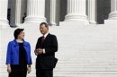 Justice Kagan talks to Chief Justice of the United States Roberts outside the Supreme Court following her formal investiture ceremony in Washington