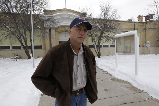 Spring City Councilman Neil Sorensen stands in front of the City Hall Tuesday, Jan. 8, 2013, in Spring City, Utah. Officials in a small Utah town are urging citizens and teachers to arm themselves for everyone's safety against any aggressor. One member of the Spring City council wants to make the edict mandatory, but police are urging restraint. Councilman Neil Sorensen says he's drafting a measure that will go before the full council in February. At first, Sorensen wanted to mandate a gun in every household in the town of 1,000. But the Sanpete County sheriff didn't think it was a good idea to force households to own guns, so Sorensen says he's inclined to make it a recommendation, not a law. (AP Photo/Rick Bowmer)