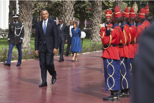 U.S. President Obama inspects an honour guard at the presidential palace in Dakar
