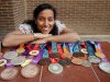 Spain's paralympic swimmer Perales poses with her 22 medals won during the four Paralympic Games she competed in at her home in Zaragoza