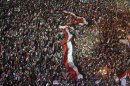 Anti-Mursi protesters chant slogans during a mass protest to support the army in Tahrir square, Cairo
