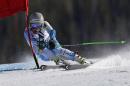 Ted Ligety, of the United States, clips a gate during the men's World Cup giant slalom skiing event Sunday, Dec. 7, 2014, in Beaver Creek, Colo. (AP Photo/John Locher)