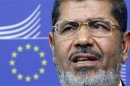 Egypt's President Mohamed Mursi answers reporters' questions after meeting European Commission President Jose Manuel Barroso in Brussels