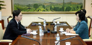 In this photo released by the South Korean Unification Ministry, South Korea's Unification Policy Officer Chun Hae-sung, left, talks with the head of North Korea's delegation Kim Song Hye, right, during their meeting at the southern side of Panmunjom which has separated the two Koreas since the Korean War, in Paju, north of Seoul, South Korea, Sunday, June 9, 2013. Government delegates from North and South Korea began preparatory talks Sunday at the "truce village" on their heavily armed border aimed at setting ground rules for a higher-level discussion on easing animosity and restoring stalled rapprochement projects. (AP Photo/South Korean Unification Ministry)