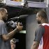 Miami Heat small forward LeBron James, left, points a video camera at shooting guard Dwyane Wade after a news conference following basketball practice on Saturday, June 8, 2013, at the American Airlines Arena in Miami. The Heat and the San Antonio Spurs are to play Game 2 of the NBA Finals, Sunday. (AP Photo/Wilfredo Lee)