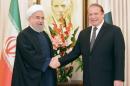 Pakistan's Prime Minister Nawaz Sharif shakes hands with Iranian President Hassan Rouhani at the Prime Minister's house in Islamabad,