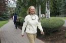 Hewlett-Packard CEO Meg Whitman walks at the annual Allen and Co. conference in Sun Valley