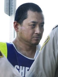 A review board may be asked Monday to grant more freedom to Vince Li, who was found not criminally responsible for stabbing and decapitating Tim McLean in July, 2008, near Portage la Prairie. Vince Li is shown in a Portage La Prairie, Man., court Tuesday, August 5, 2008. THE CANADIAN PRESS/John Woods