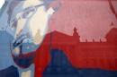 Reichstag pictured though flag depicting fugitive former U.S. NSA contractor Snowden in Berlin
