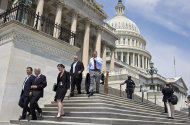 FILE - In this Friday, Aug. 2, 2013, file photo, members of Congress walk down the steps of the House of Representatives on Capitol Hill in Washington. The Treasury reports on the budget deficit for August on Thursday, Sept. 12, 2013. (AP Photo/J. Scott Applewhite, File)