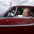 Irv Gordon poses for a picture in his Volvo P1800 in Babylon, N.Y., Monday, July 2, 2012. Gordon's car already holds the world record for the highest recorded milage on a car and he is less than 40,000 miles away from passing three million miles on the Volvo.  (AP Photo/Seth Wenig)