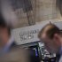 A Goldman Sachs sign is seen over the company's trading stall on the floor at the New York Stock Exchange