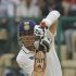 India's Tendulkar hits a shot against New Zealand during the fourth day of their second test cricket match in Bangalore