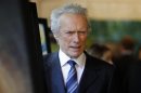 Clint Eastwood poses as he arrives at the AFI Awards in Beverly Hills