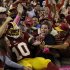 Washington Redskins quarterback Robert Griffin III (10) celebrates with the fans after a 76-yard touchdown run during the second half of an NFL football game against the Minnesota Vikings, Sunday, Oct. 14, 2012, in Landover, Md. (AP Photo/Pablo Martinez Monsivais)