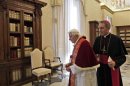 Pope Benedict XVI and his personal secretary Georg Gaenswein leave after meeting Guatemala's President Otto Perez Molina, during a private audience at the Vatican
