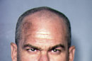 This image provided by the Las Vegas Metropolitan Police Department shows David Allen Brutsche, 42, who was arrested on domestic terrorism charges in Las Vegas. A four-month undercover operation in Las Vegas led to the arrests of Brutsche and Devon Campbell Newman. The arrests stopped a plot to abduct, torture and kill police officers in an effort to bring attention the "sovereign citizen" movement, authorities said Thursday, Aug. 22, 2013. (AP Photo/Las Vegas Metropolitan Police Department)