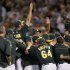 Oakland Athletics players celebrate after earning a wild card berth in Oakland