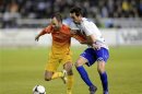 Barcelona's Andres Iniesta fights for the ball with Deportivo Alaves' Guzman Casaseca during their Spanish King's Cup soccer match in Vitoria