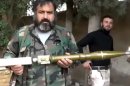 In this image taken from video obtained from the Ugarit News, which has been authenticated based on its contents and other AP reporting, the Union of Syria's Victory Battalions prepare a rocket in Aleppo, Syria, on Monday, Nov. 26, 2012. (AP Photo/Ugarit News via AP video)