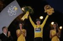 2013 Tour de France cycling race winner Christopher Froome of Britain, wearing the overall leader's yellow jersey, celebrates on the podium of the 100th edition of the Tour de France cycling in Paris, France, Sunday July 21 2013. (AP Photo/Laurent Cipriani)