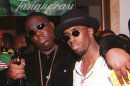 **FILE**In this March 8, 1997 file photo, Notorious B.I.G., whose real name is Christopher Wallace, left, gestures as he and producer Sean "Diddy" Combs leave a party at the Petersen Automotive Museum in Los Angeles late Saturday evening, shortly before Wallace was shot to death. Authorities have unsealed an autopsy report the week of Nov. 26, 2012 showing that rapper Notorious B.I.G. was shot four times in a 1997 drive-by shooting that remains unsolved. (AP Photo/Venus Bernardo-Prudhomme, File)