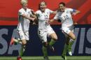 From left, United States' Megan Rapinoe, Lauren Holiday, and Carli Lloyd celebrate after Lloyd scored her second goal of the match against Japan during the first half of the FIFA Women's World Cup soccer championship in Vancouver, British Columbia, Canada, Sunday, July 5, 2015. (AP Photo/Elaine Thompson)