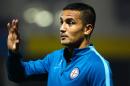 Australian international Tim Cahill warms up before his debut FFA match for Melbourne City against the Brisbane Strikers, at Perry Park in Brisbane, on August 24, 2016
