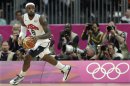 United States' Lebron James looks up the court during the first half of a preliminary men's basketball game against France at the 2012 Summer Olympics, Sunday, July 29, 2012, in London. (AP Photo/Charles Krupa)