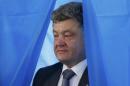 Ukrainian presidential candidate Poroshenko leaves a booth before casting his vote during presidential election at a polling station in Kiev