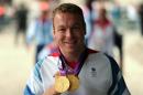 British Olympic gold medal-winning cyclist Chris Hoy poses in central London on September 10, 2012