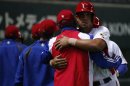 Cuba's Abreu reacts after hitting a grand slam off China's Liu in the fifth inning at the WBC qualifying first round game in Fukuoka