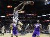 San Antonio Spurs' Kawhi Leonard (2) scores over Los Angeles Lakers' Antawn Jamison (4) and Metta World Peace (15) during the first half of Game 2 of a first-round NBA basketball playoff series on Wednesday, April 24, 2013, in San Antonio, Texas. (AP Photo/Eric Gay)