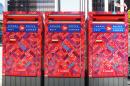 Canada Post is temporarily suspending its program to switch from door-to-door delivery to centralized community mailboxes