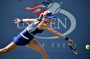 Eugenie Bouchard of Canada returns a shot to Ekaterina Makarova of Russia during their 2014 US Open women's singles match on September 1, 2014 in New York