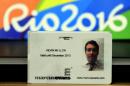 A business identification card belonging to Kevin Mallon, director of British hospitality firm THG Sports, is displayed during a press conference at the City Police's station in Benfica, north of Rio de Janeiro, Brazil, on August 8, 2016
