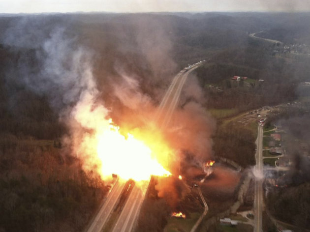 This image provided by the West Virginia State Police shows a fireball erupting across Interstate 77 from a gas line explosion in Sissonville, W. Va.,Tuesday Dec. 11, 2012. At least five homes went up in flames Tuesday afternoon and a badly damaged section of Interstate 77 was shut down in both directions near Sissonville after a natural gas explosion triggered an hour-long inferno that officials say spanned about a quarter-mile.  (AP Photo/West Virginia State Police)