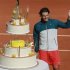 Nadal of Spain poses with his birthday cake after winning his men's singles match against Nishikori of Japan at the French Open tennis tournament in Paris