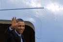 US President Barack Obama waves as he boards Air Force One at Fiumicino Airport, Friday, March 28, 2014 in Rome. Obama departs Italy for Saudi Arabia, to meet with King Abdullah, the final stop on a weeklong overseas trip. (AP Photo/Riccardo De Luca)