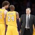 Los Angeles Lakers head coach Mike D'Antoni smiles with Pau Gasol of Spain and Kobe Bryant during their NBA basketball game against the Brooklyn Nets, as he makes his game coaching debut for the Lakers, in Los Angeles