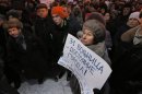A demonstrator holds a poster reading "Hospital No. 31 is a city property" during a protest against plans to shut down City Hospital No. 31 in St. Petersburg, Russia, Wednesday, Jan. 23, 2013. Some 1,500 thousand people gathered for a rally against plans to shut a clinic specialized in treating children with cancer in order to turn it into a medical center for the nation's top judges. The authorities intention to turn City Hospital No. 31 into a clinic that would exclusively serve judges of Russia's top courts, which are being relocated to St.Petersburg from Moscow, has caused a strong public dismay. On Wednesday, St.Petersburg Governor's office said that the hospital will continue to serve patients as before and there is no plan to change its location or profile. (AP Photo/Dmitry Lovetsky)